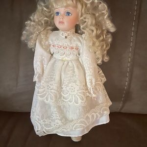 Beautiful Porcelain Doll clothed in delicate Lace